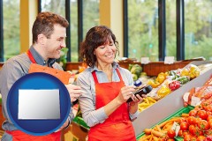 colorado map icon and two grocers working in a grocery store