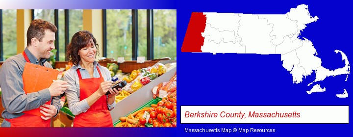 two grocers working in a grocery store; Berkshire County, Massachusetts highlighted in red on a map