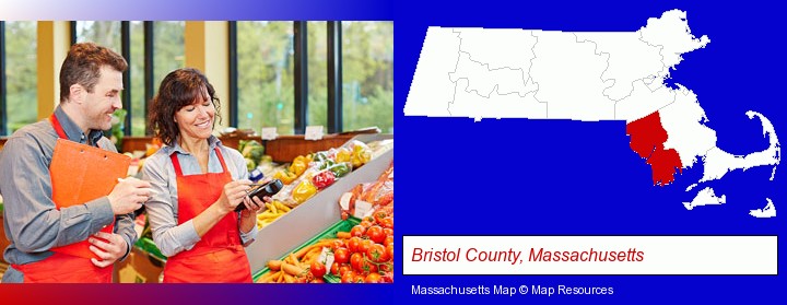 two grocers working in a grocery store; Bristol County, Massachusetts highlighted in red on a map