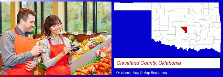 two grocers working in a grocery store; Cleveland County, Oklahoma highlighted in red on a map