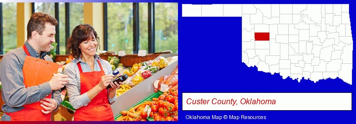 two grocers working in a grocery store; Custer County, Oklahoma highlighted in red on a map