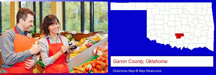 two grocers working in a grocery store; Garvin County, Oklahoma highlighted in red on a map