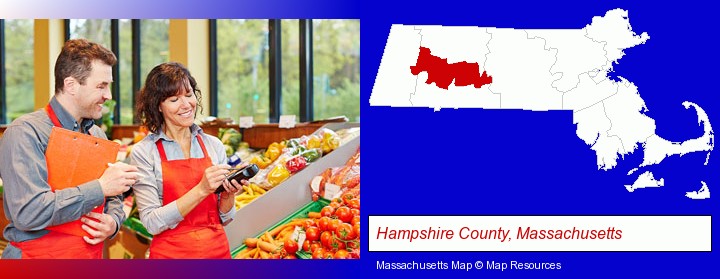 two grocers working in a grocery store; Hampshire County, Massachusetts highlighted in red on a map