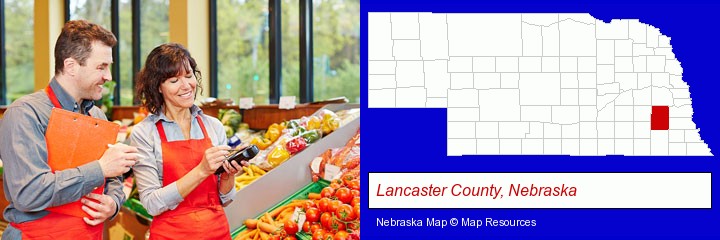 two grocers working in a grocery store; Lancaster County, Nebraska highlighted in red on a map