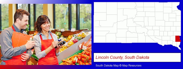 two grocers working in a grocery store; Lincoln County, South Dakota highlighted in red on a map