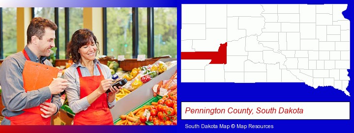 two grocers working in a grocery store; Pennington County, South Dakota highlighted in red on a map
