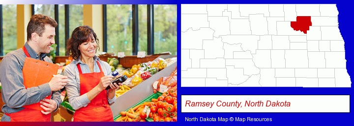 two grocers working in a grocery store; Ramsey County, North Dakota highlighted in red on a map