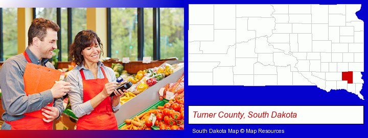 two grocers working in a grocery store; Turner County, South Dakota highlighted in red on a map