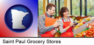 two grocers working in a grocery store in Saint Paul, MN