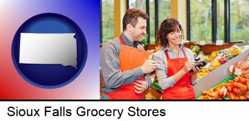 two grocers working in a grocery store in Sioux Falls, SD