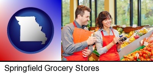 Springfield, Missouri - two grocers working in a grocery store