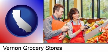 two grocers working in a grocery store in Vernon, CA