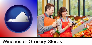 two grocers working in a grocery store in Winchester, VA